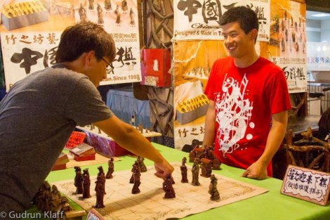 Chess players on the night market